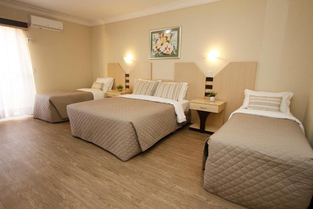 Luxo Quádruplo Casal/Solteiro - PNE - Sky Ville Hotel Canela